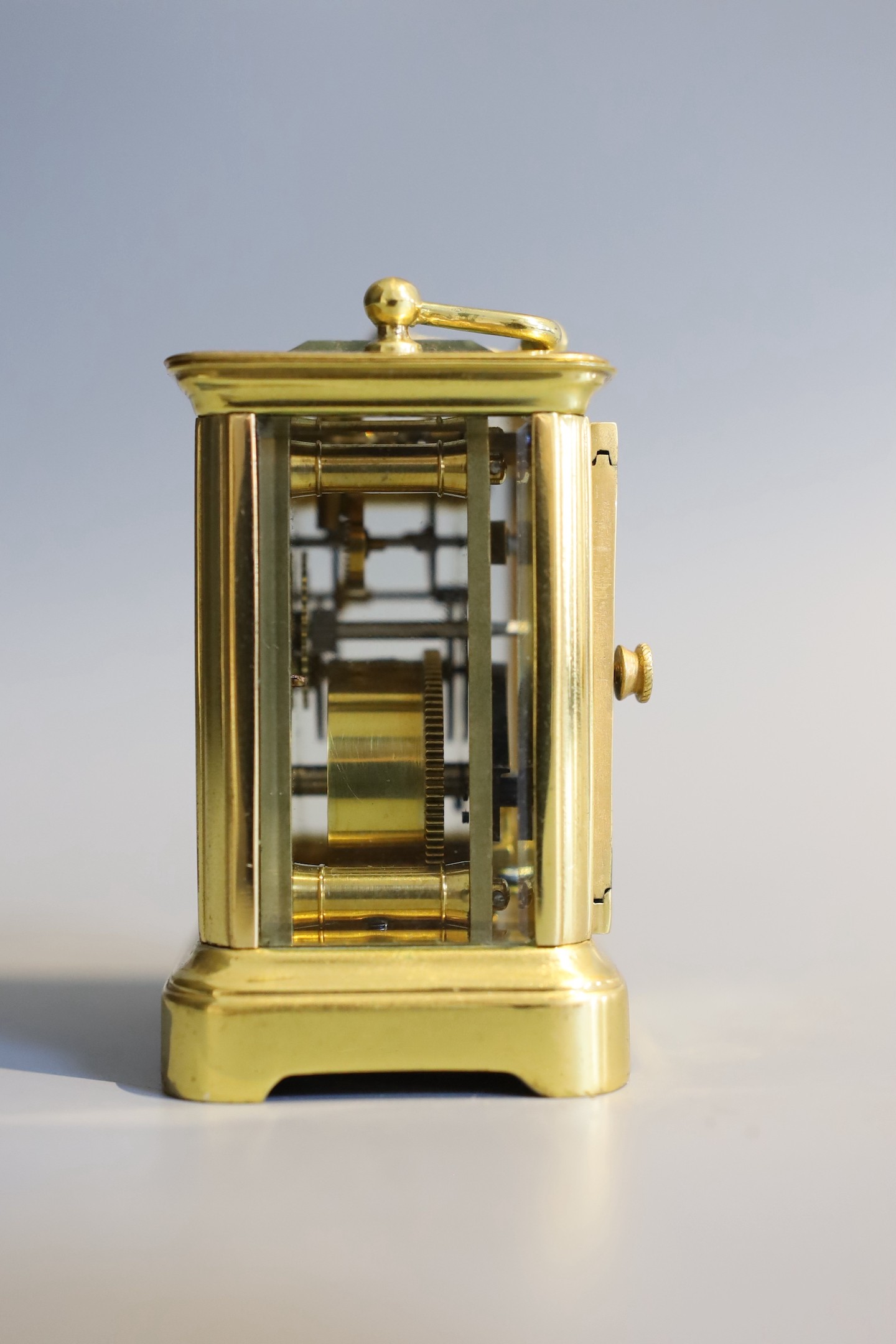 A 19th century French lacquered brass miniature carriage timepiece, height 7cm